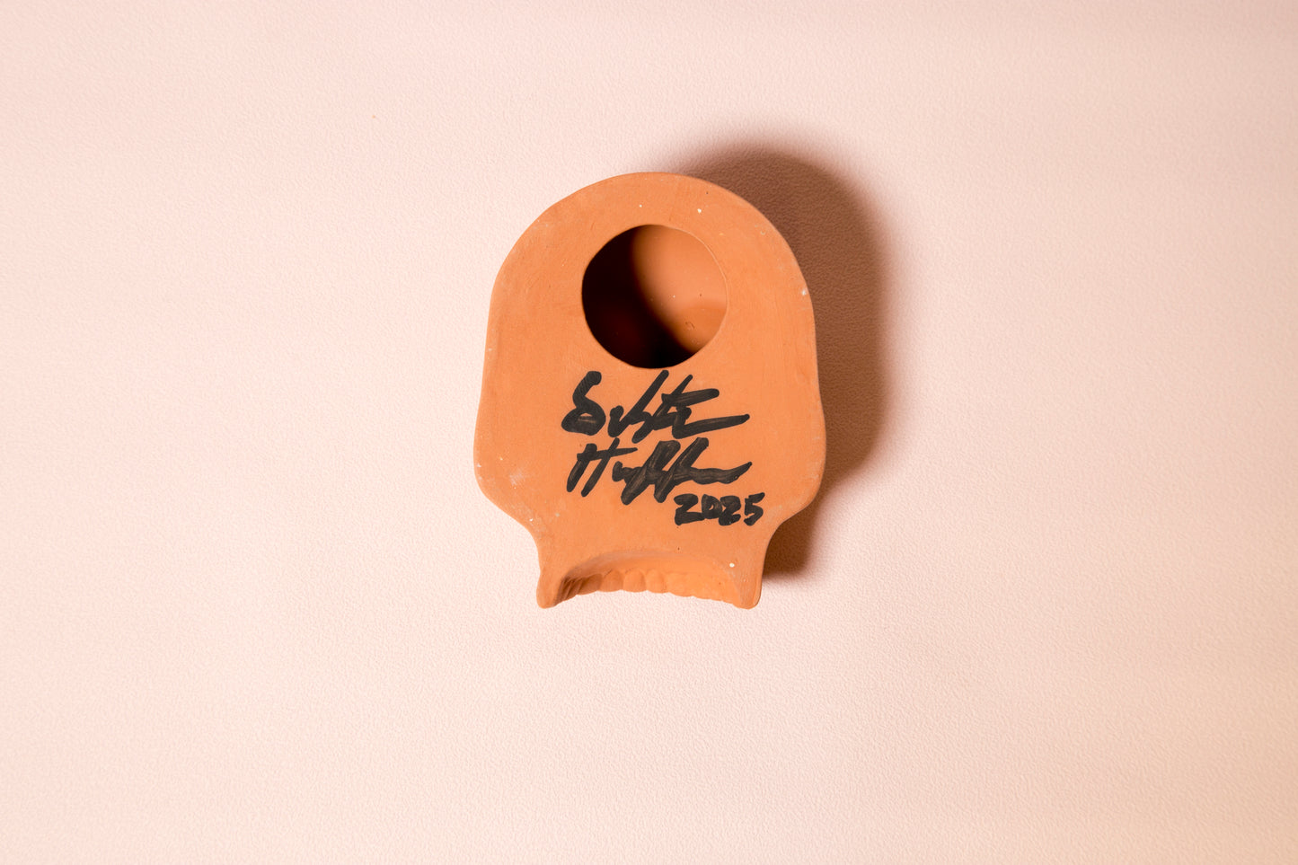 Terracotta skull wall ornament