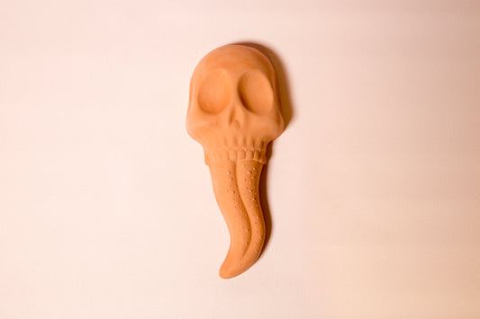 Terracotta skull tongue wall ornament