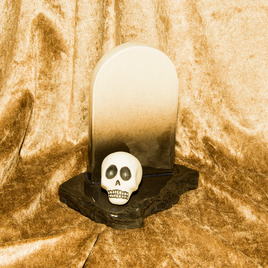 Gravestone and skull sculpture